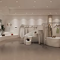 Modern Clothing Store Interior With Hanging Garments And Circular Display Racks