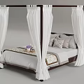Four Poster Bed With White Draperies And Decorative Pillows In Bedroom