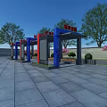 Outdoor Pergola With Blue Red Columns In Paved Square Surrounded By Trees And Blue Sky