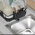 Black Kitchen Dish Rack With Plates Bowls Spoons Near Sink On Marble Countertop