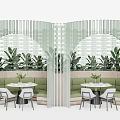 Stylish Indoor Seating Area With Irregular Shaped Sofa Green Plants And Arched Windows