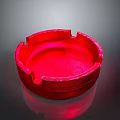 Red Circular Ashtray With Smooth Surface And Reflective Background Design