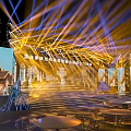 Modern Stage Setup With Illuminated Lighting Steps Backdrop Displays And Front Table