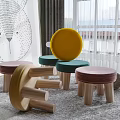 Colorful Mushroom Shaped Stools With Velvet Seats And Wooden Legs In Living Room