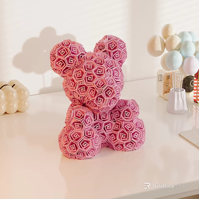 Pink Geometric Pattern Fabric Bear Doll Sitting on White Table with Decorative Balls 3d model 