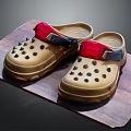 Beige Rubber Clogs With Red Straps Blue Buckles And Perforated Design On Wooden Platform