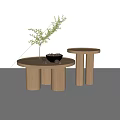 Wooden Round Coffee Tables Featuring Vase With Green Plant And Bowl Of Nuts