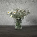 White Daisies in Clear Glass Vase on Wooden Table Against Gray Wall