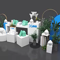 XOMI Art Installation With White Display Stands Green Boxes And Curved Arches