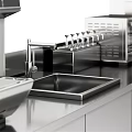 Elegant Modern Kitchen Interior Featuring Stainless Steel Cabinets And Appliances