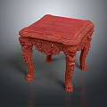 Traditional Red Wooden Table With Intricate Carvings On Legs And Frame
