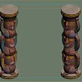 Two Colorful Traditional Totem Poles With Carved Human Faces And Ornate Tops