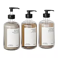 Daily Washing Essentials With Pump Bottles Candles Towels Eucalyptus And Wooden Shelf