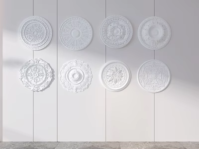 Multiple White Ceiling Medallions with Various Decorative Patterns Arranged on Wall 3d model