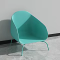 Turquoise Leisure Chair with Sleek Curved Back and Metal Legs in Modern Indoor Space
