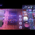 Vibrant Neon Lit Stage With Chinese Character Signs And Reflective Floor