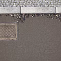 Road Infrastructure Manhole Cover with Patterned Design on Asphalt Pavement Near Curb with Fallen Leaves