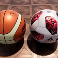 Premium Sports Equipment Including Basketball and Soccer Ball with Distinctive Patterns on Wooden Floor