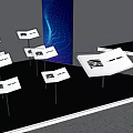Modern Exhibition Setup With Blue Stands And Information Displays