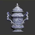 Blue And White Intricate Carved Urn Sculpture Featuring Cherub Designs And Ornate Patterns
