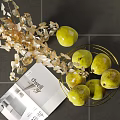 Fresh Green Pears in Gold Metal Basket with Golden Leaf Decoration and Dwell Magazine