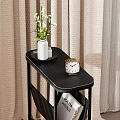 Minimalist White Side Table With Vase Clock And Magazines In Bedroom Setting