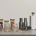Modern Spice Bottles with Glass Storage Jars Wooden Lids and Silver Metal Containers on Light Countertop