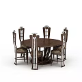Elegant Carved Dining Chairs Surrounding Round Wooden Table With Metal Accents