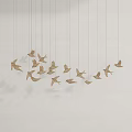 Artistic Multiple Golden Bird Shaped Chandelier Hanging In White Background Decor