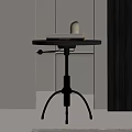 Modern Side Table With Round Black Top Metal Frame And Stacked Books