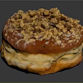 Freshly Baked Golden Fluffy Donut Topped with Crushed Nuts and Sweet Glaze