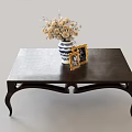 Elegant Dark Colored Coffee Table With Blue And White Vase Flowers And Photo Frame