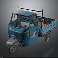 Blue Three Wheeled Cargo Truck With Open Bed And Metal Frame Cab