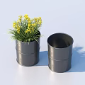 Bonsai Potted Plant With Yellow Small Flowers And Green Grass In Black Barrel Shaped Pot