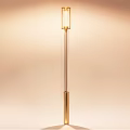 Modern Floor Standing Outdoor Light With Golden Pole And Transparent Lampshade Emitting Warm Light