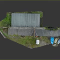 Old Red Brick Building with Gray Roof Plants White Shed Grass Blue Boats Near Waterfront