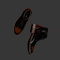Lace up leather boots black and brown with detailed sole reflective surface on dark background