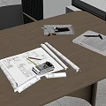 Desk With Rolled Blueprints Ruler Pencil Open Notebook And Mobile Phone