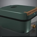 Teal Green Compact Electronic Appliance With Orange Top Gold Accents And Brand Logo