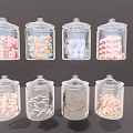 Transparent Glass Cups Filled With Colorful Candies In Various Shapes And Hues