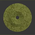 Green Circular Jade Artifact With Central Hole And Intricate Textured Surface