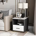 Black and White Bedside Tables with Marble Top Drawers Lamps and Photo Frames