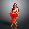 Woman In Santa Hat On Director's Chair With Red Stockings Holding Drink And Food Plate
