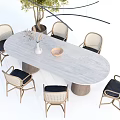 Oval Light Gray Dining Table Set With Rattan Chairs Black Seats Vase And Tree