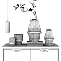 Transparent Glass Decorative Ornament Set With Gold Accents On Blue Cabinet And Books