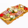 Delicious Assorted Food Platter on Wooden Tray with Meats Cheeses Vegetables and Fruits