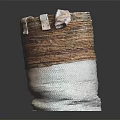 Woven Storage Basket With Brown And White Design Holding Decorative Fabric Items