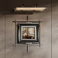 Elegant Wall Decor With Framed Artworks And Sconce Lighting On Wooden Panel