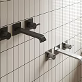 Two Black And Silver Faucets Mounted On White Tiled Wall With Window Blinds