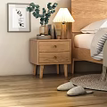Wooden Bedside Table With Drawers Lamp Plants Books Beside Bed Striped Blanket And Woven Rug